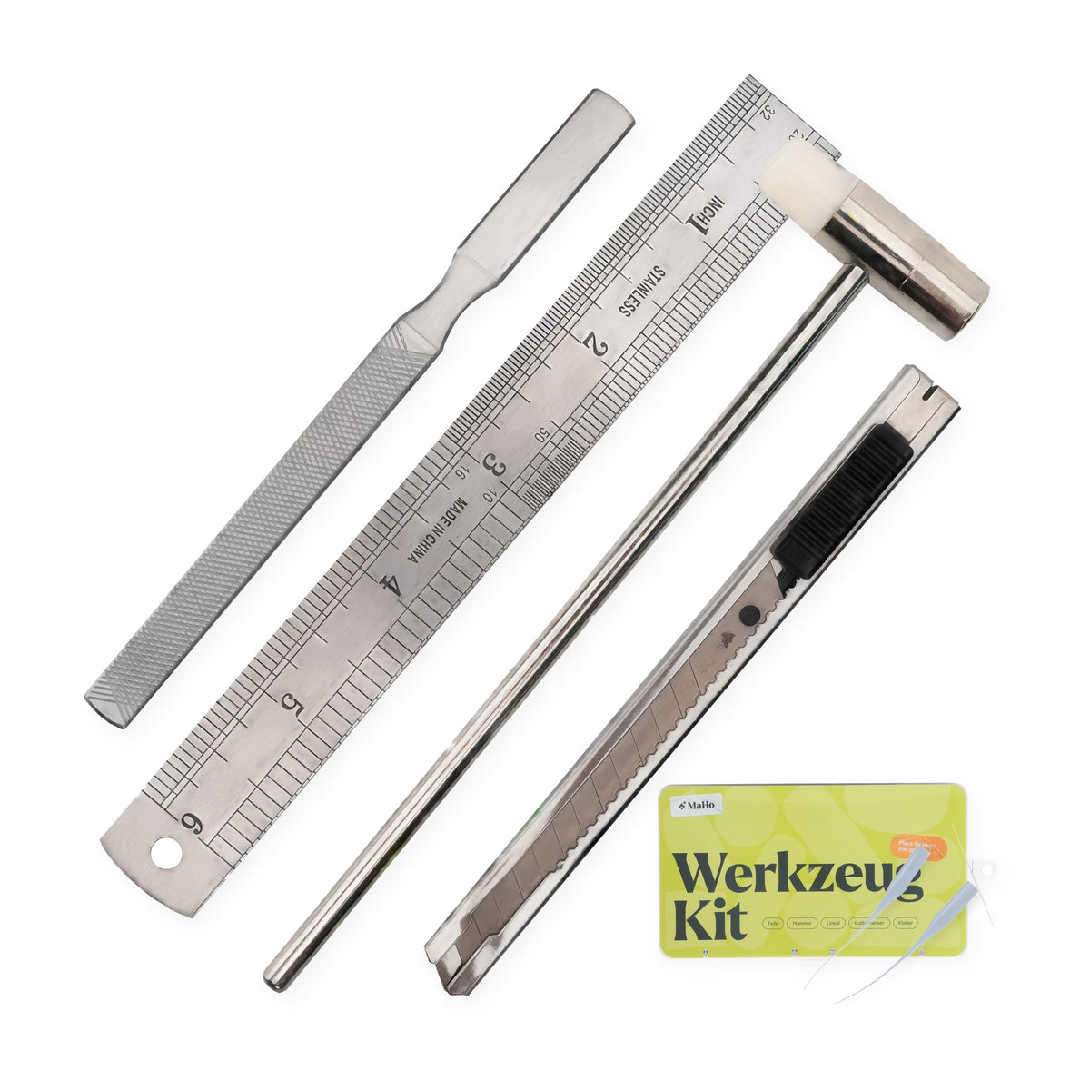 Model-making tool set, craft knife, file, ruler, and mini hammer arranged diagonally on a white background, plus 2 glue tips on the box