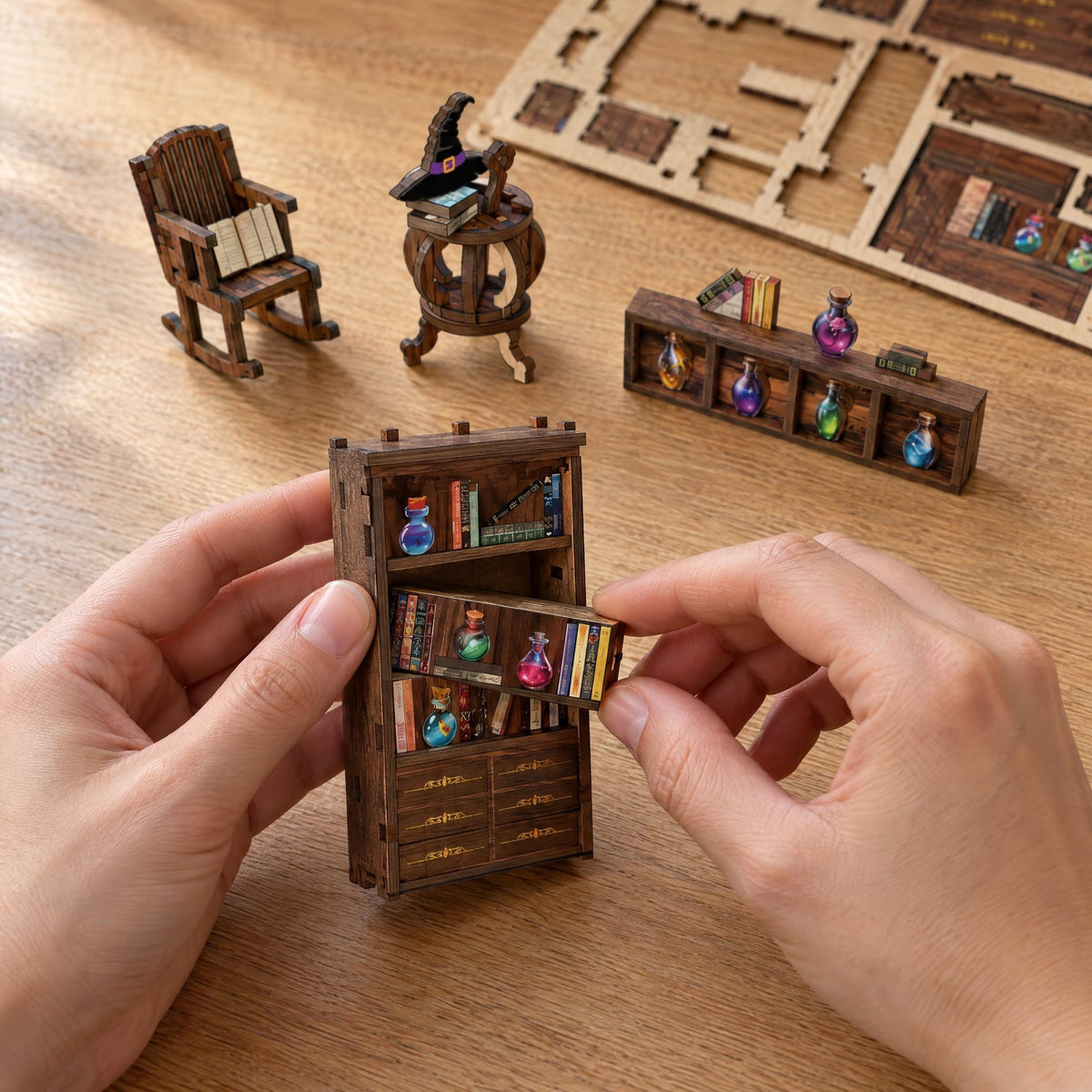 Magic Lab Book Nook, tijdens het bouwen: twee handen plaatsen een plank met miniboekjes in de kleine boekenkast