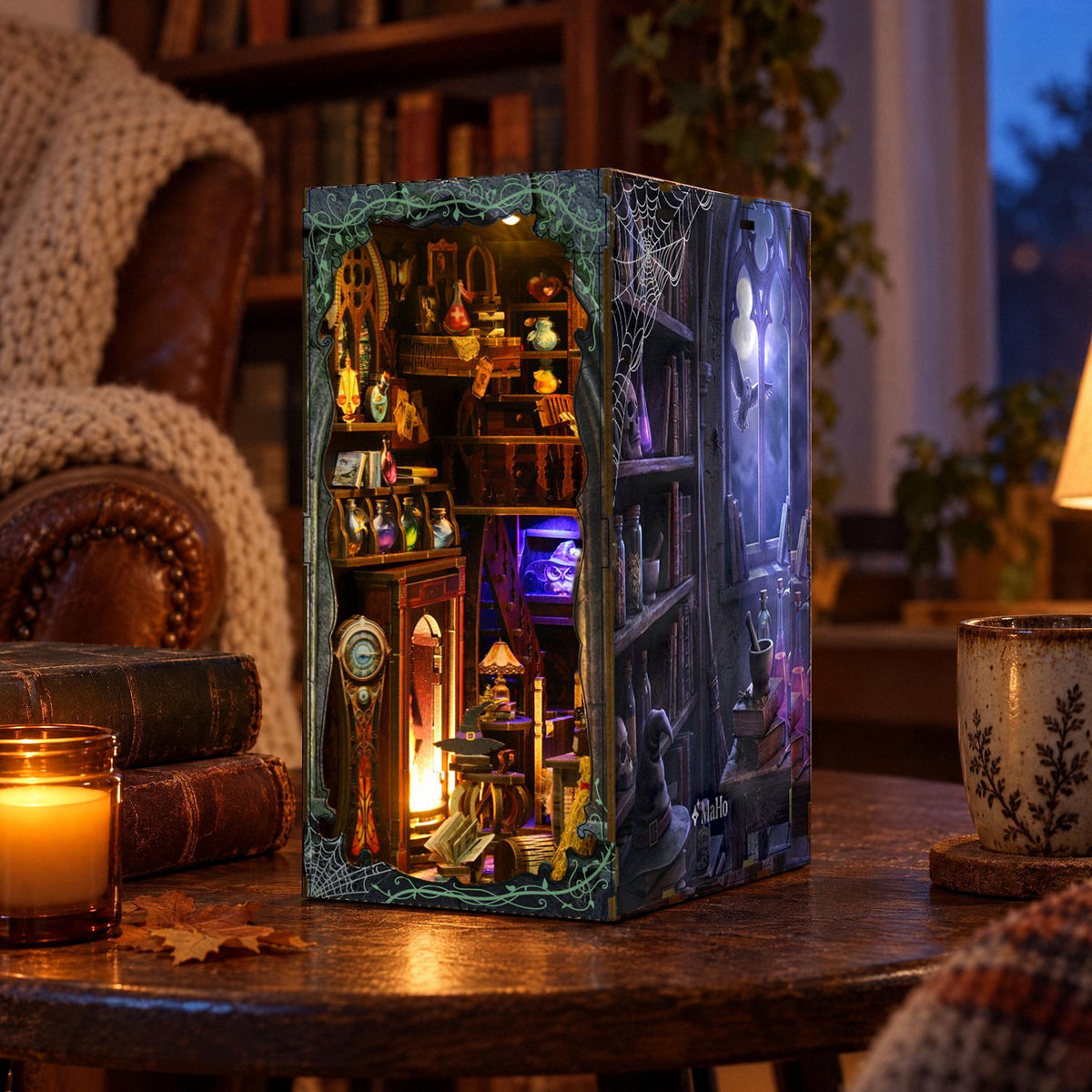 Magic Lab Book Nook, right side panel with moon window and owl, on the side table in the evening next to an LED candle in a glass jar