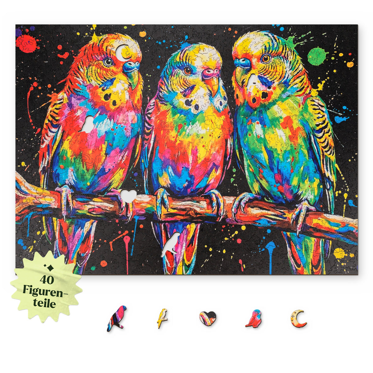 Puzzle en bois « Perruches colorées », motif vu d'en haut sur fond blanc, avec en dessous des pièces représentant un perroquet, une perruche et un cœur