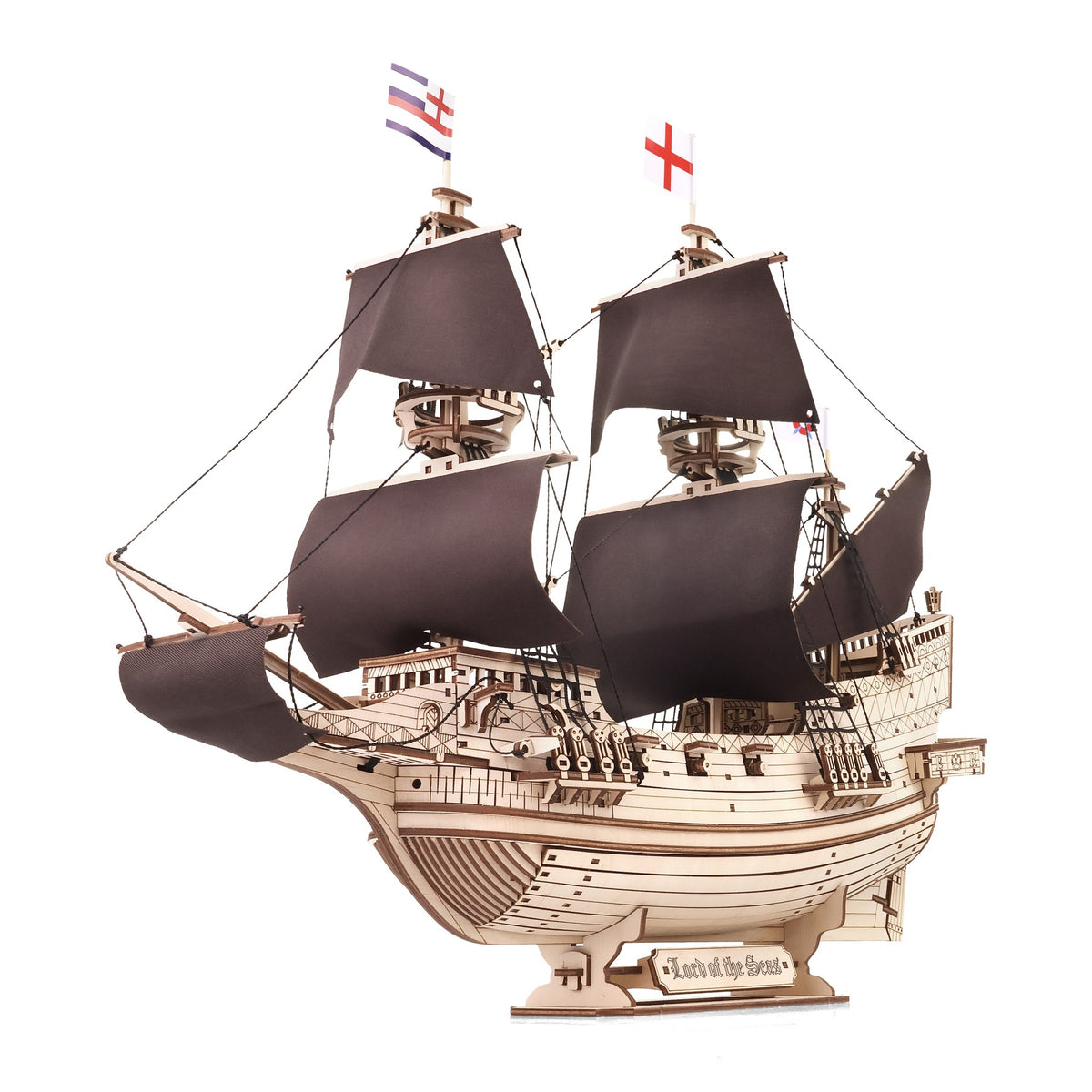 "Lord of the Seas" sailing ship, wooden model kit on a white background, three-masted ship with black sails in a three-quarter view