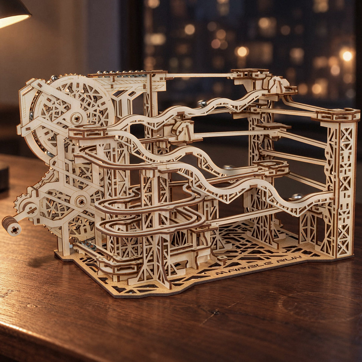 Cyclone Marble Run wooden marble run, assembled that evening on the desk in front of the window with the city lights in the background