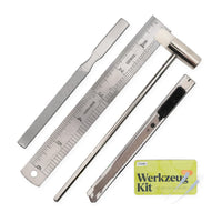 Model-making tool set, craft knife, file, ruler, and mini hammer arranged diagonally on a white background, plus 2 glue tips on the box