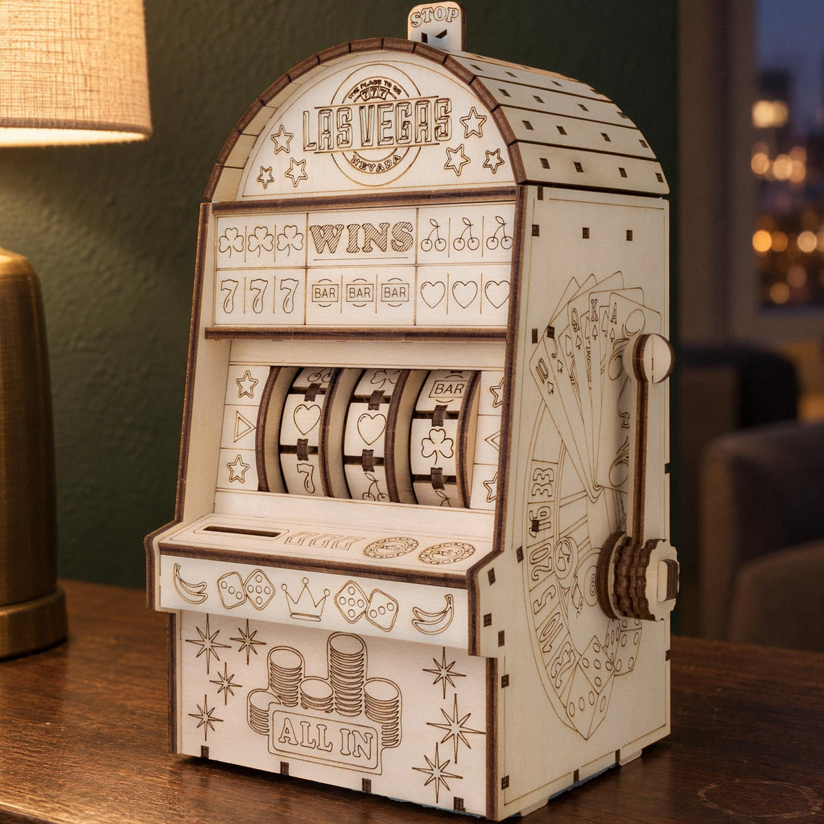 One-Armed Bandit Wooden Model Kit, fully assembled on a walnut sideboard in front of a green wall in the evening light