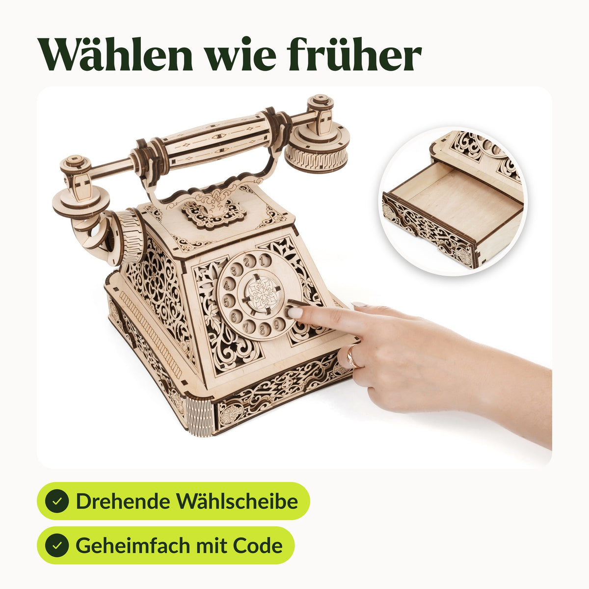 Retro Telephone – Vintage Bausatz, Hand dreht die Wählscheibe, im Kreis die offene Geheimfach-Schublade