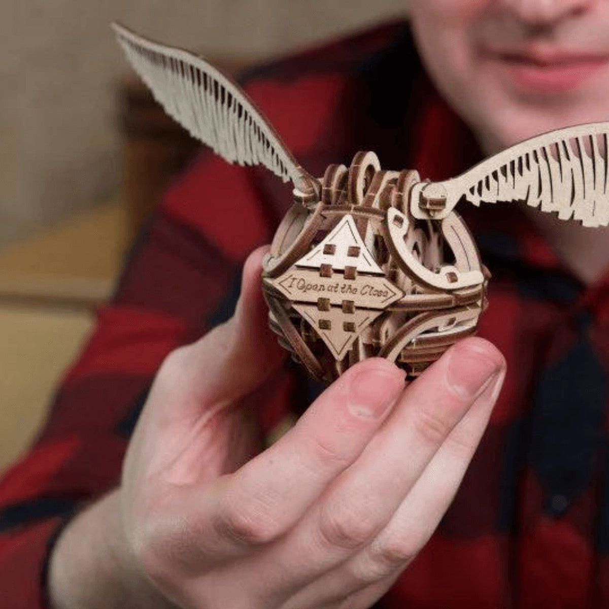 Golden Snitch – Harry Potter, a finished wooden model kit held by an adult: this is how big it really is